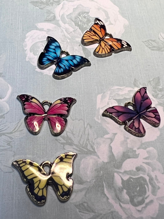 Multi colored butterfly charms with gold tone backs, set of five, five colors (etsy image id: 4888750161)