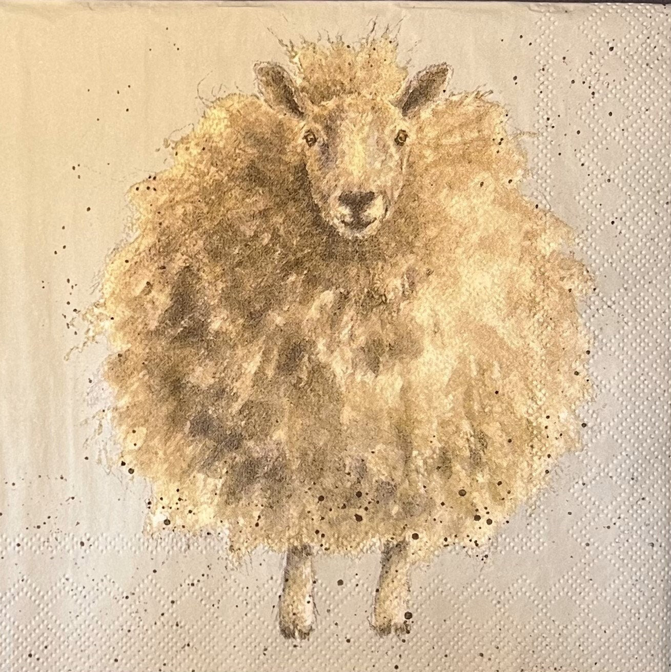 This napkins has a watercolor type illustration of a a very fluffy sheep in light cream, tan and light browns. (etsy image id: 4803898320)