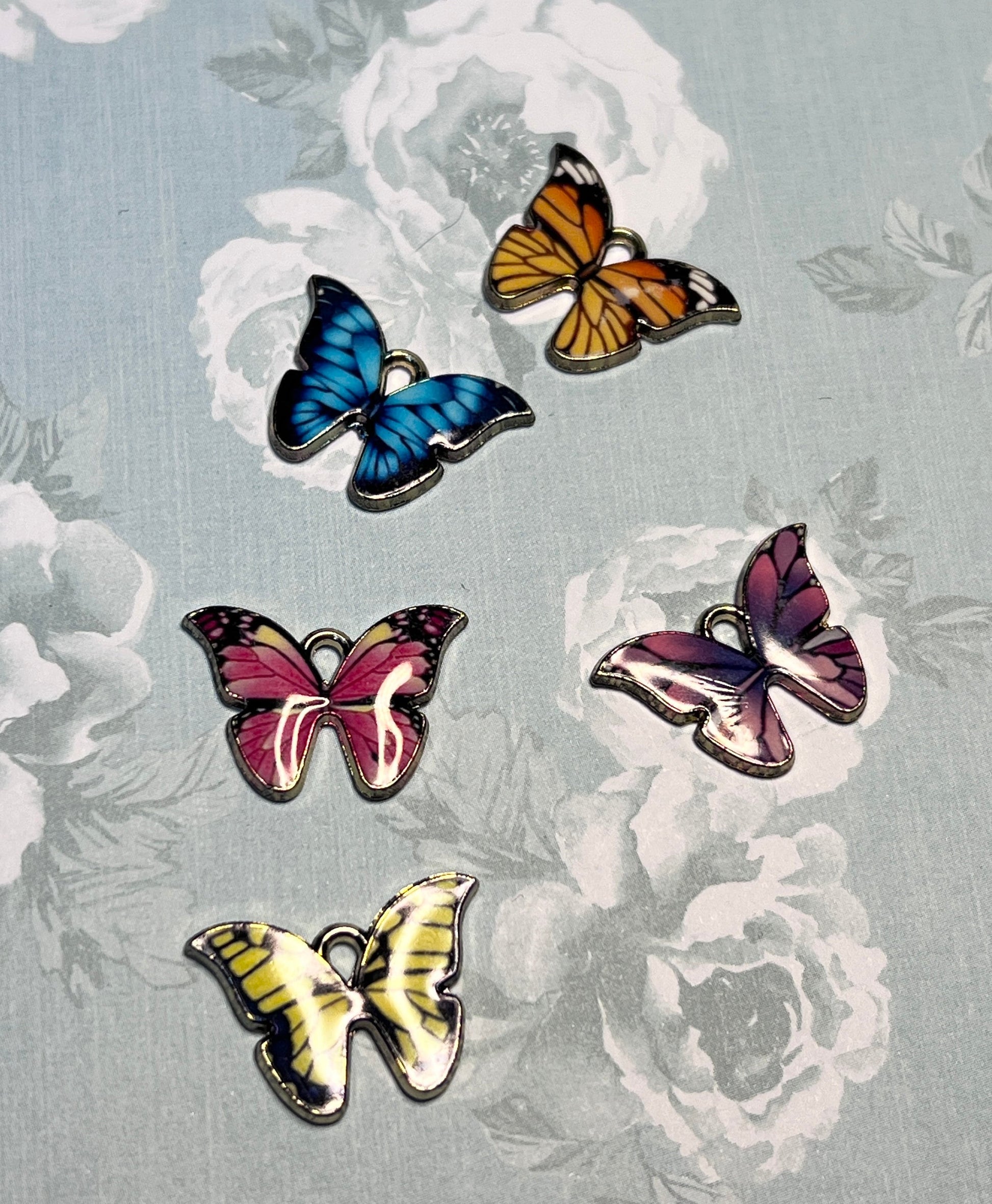 Multi colored butterfly charms with gold tone backs, set of five, five colors (etsy image id: 4840490650)