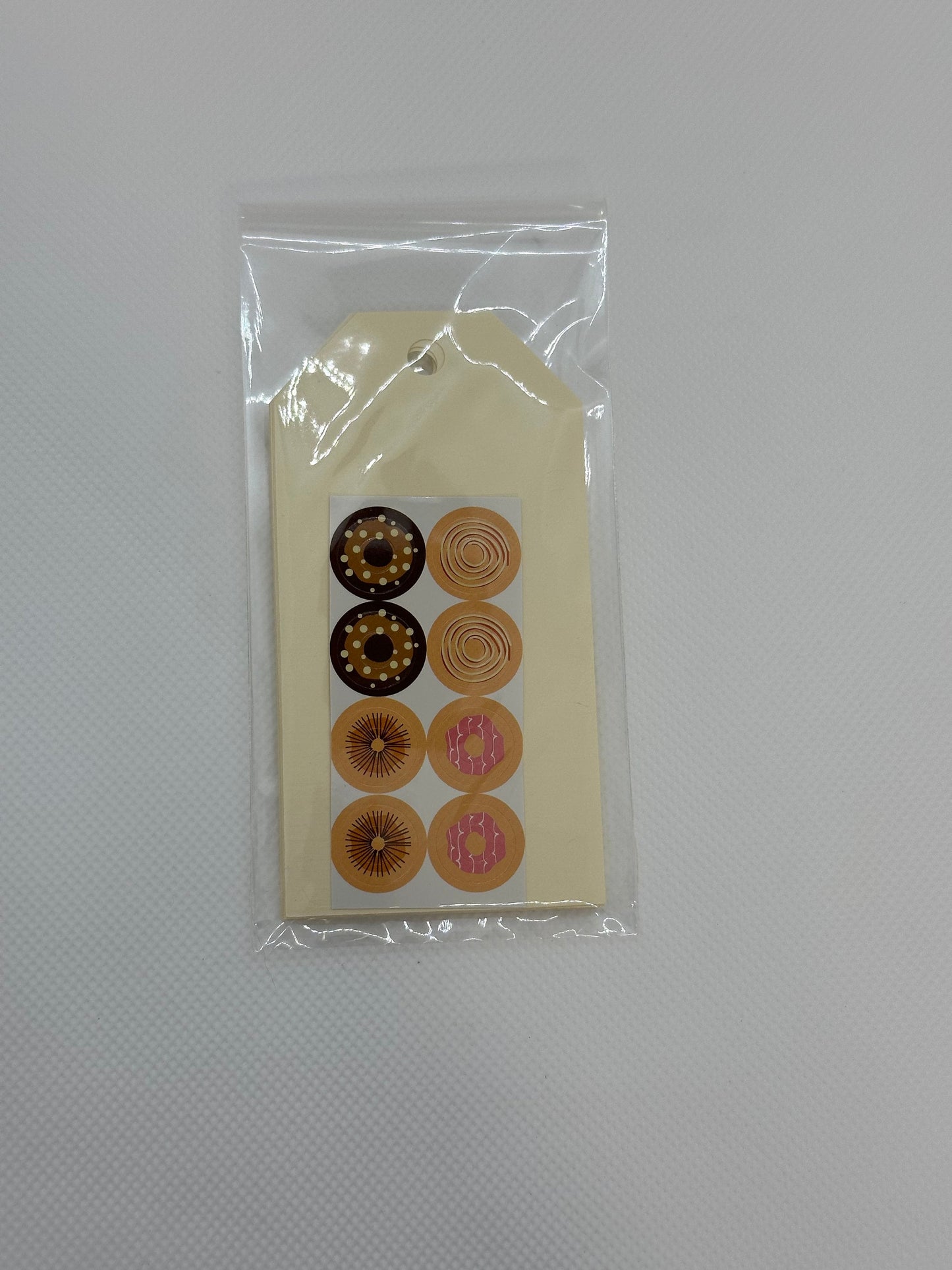 Maila Tags with donut stickers for the tag hole (etsy image id: 5849987390)