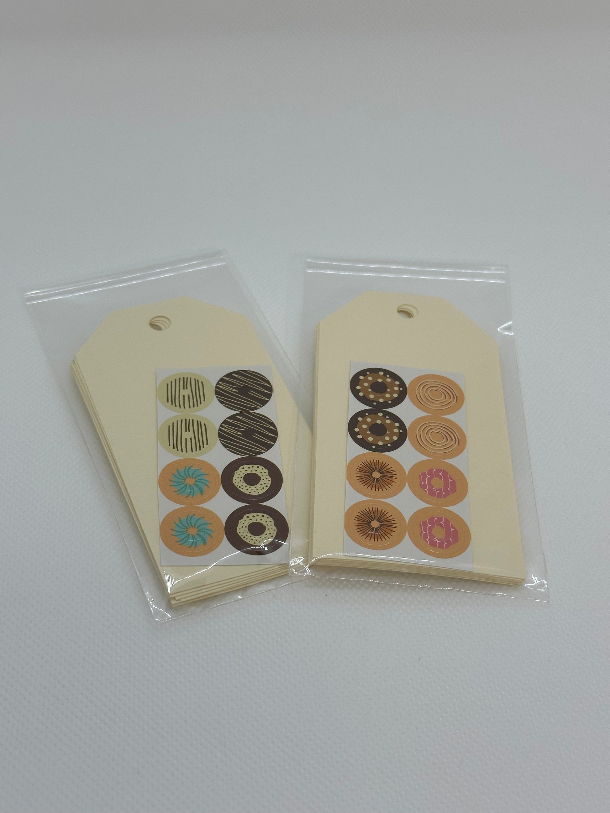 Maila Tags with donut stickers for the tag hole (etsy image id: 5849987392)