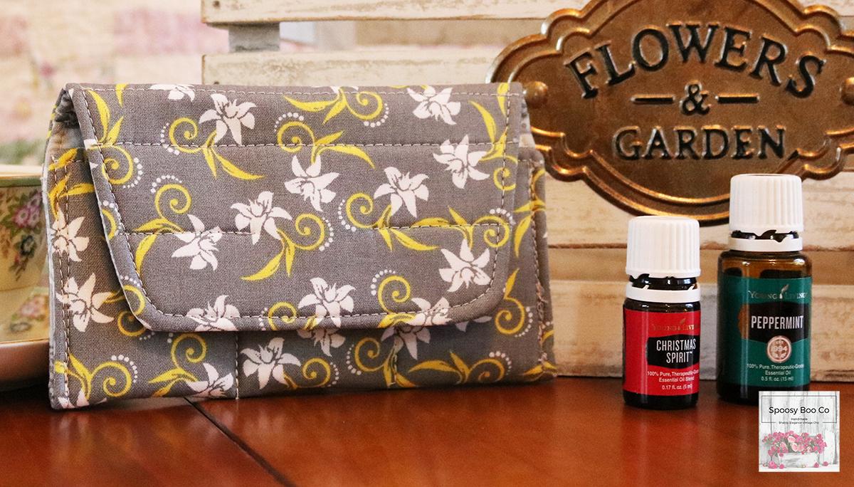 Grey background fabric small bottle pouch fits 3 bottles, features white flowers with yellow stylized swirls (etsy image id: 6528071086)