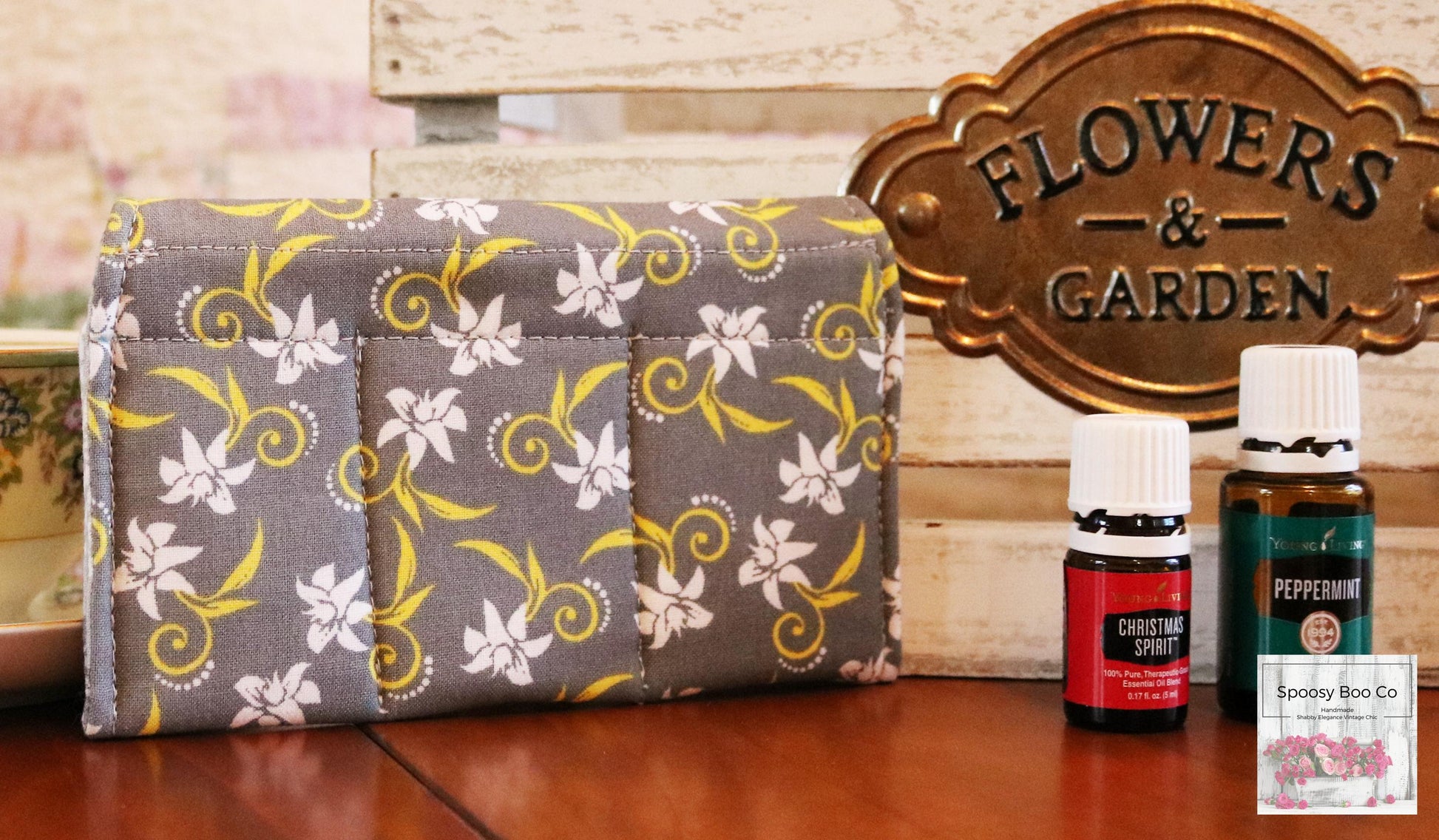 Grey background fabric small bottle pouch fits 3 bottles, features white flowers with yellow stylized swirls (etsy image id: 6528071128)