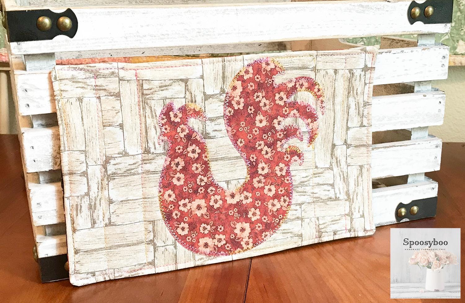 Mug rug used for placing your drink on along with a pastry.  has floral applique of a chicken  and the background is a rustic wood print on 100% cotton. Lightly quilted. (etsy image id: 6576277947)