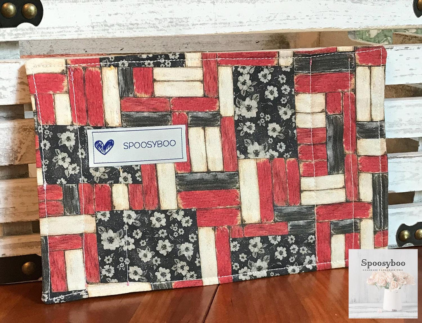Mug rug used for placing your drink on along with a pastry. The back side has a red black and cream fence type print with the spoosyboo label (etsy image id: 6576288747)
