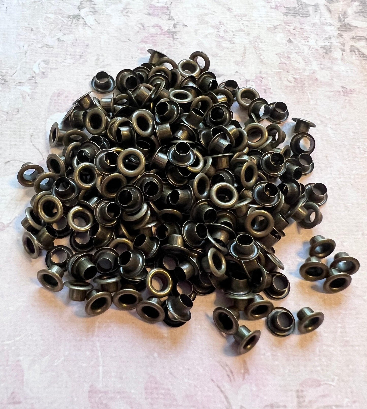 This image is of a pile of antique brass 3mm bead caps (etsy image id: 7763957542)