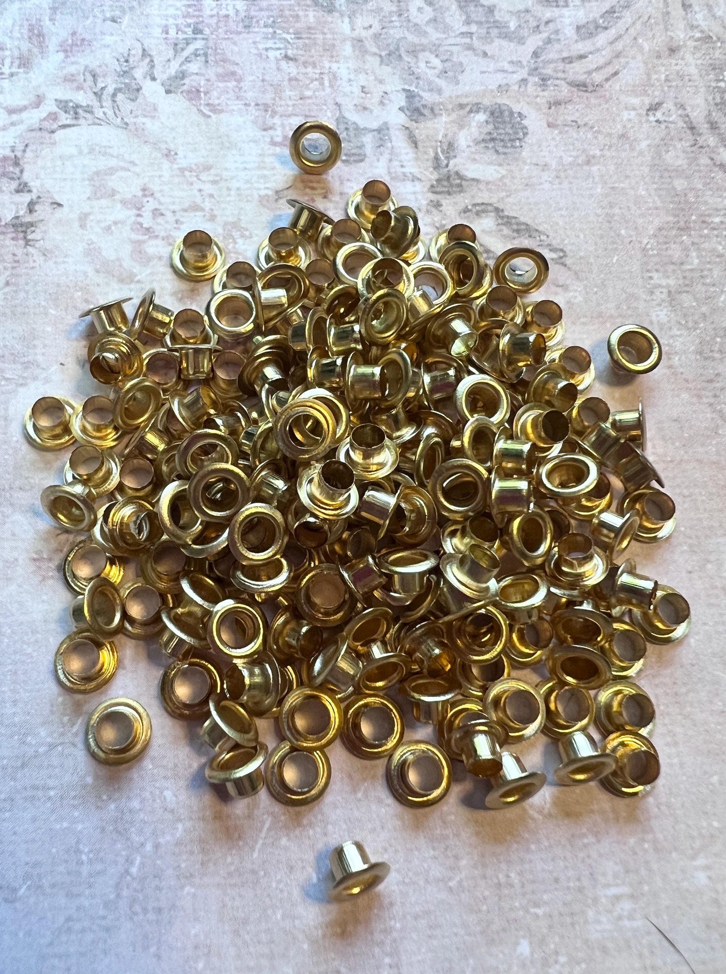 image of a large pile of goldtone 3mm bead caps (etsy image id: 7763957696)