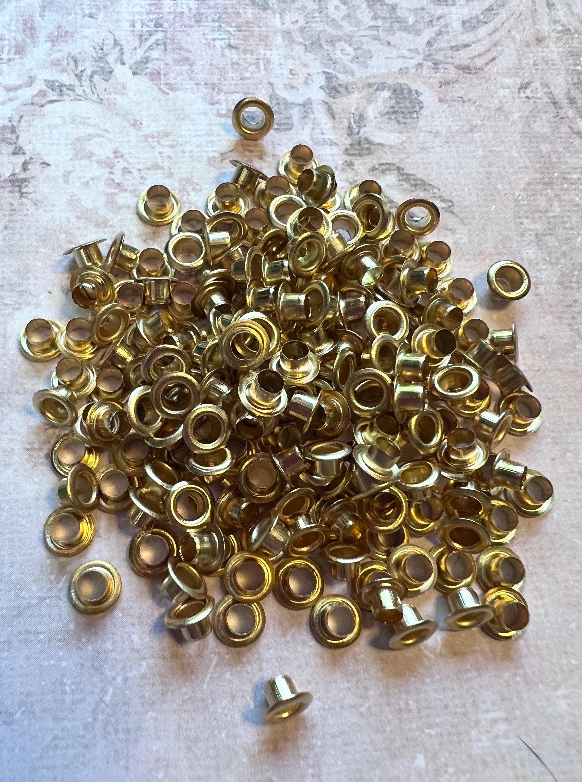 image of a large pile of goldtone 3mm bead caps (etsy image id: 7763957696)