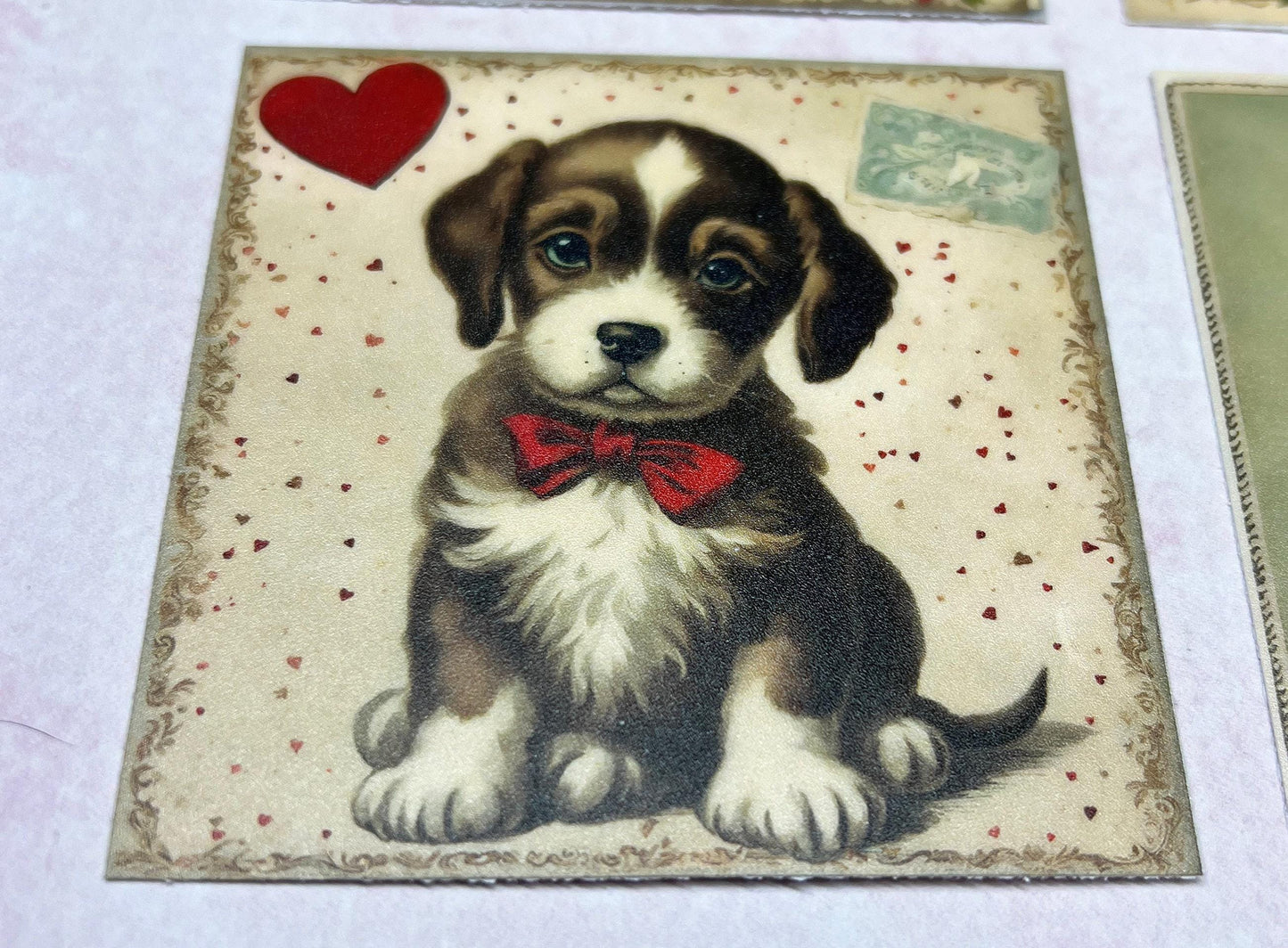 Vintage Puppy  with red bow and a red heart in the upper left corner on a cream background with lots of very tiny red hearts (etsy image id: 7808617563)