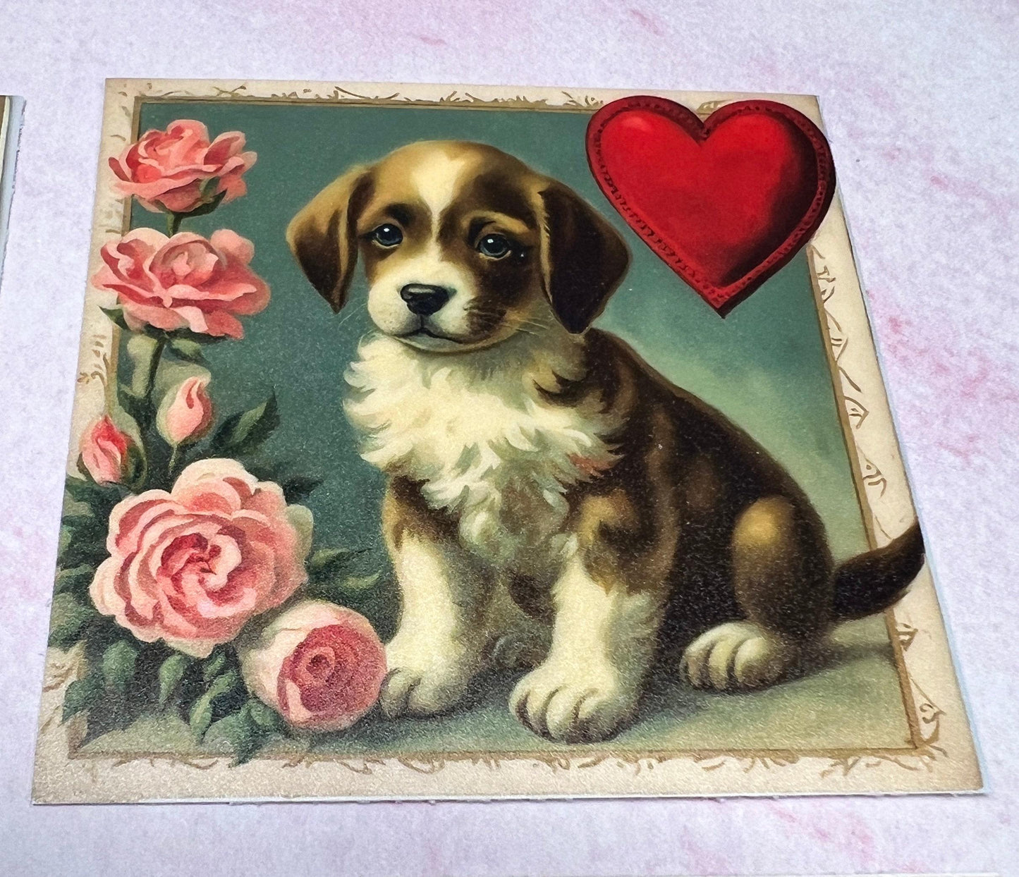 Sideview of sitting vintage puppy with antique style pink roses on the Left side and a red heart int he upper right hand corner on a greenish, watercolor type background (etsy image id: 7808617641)