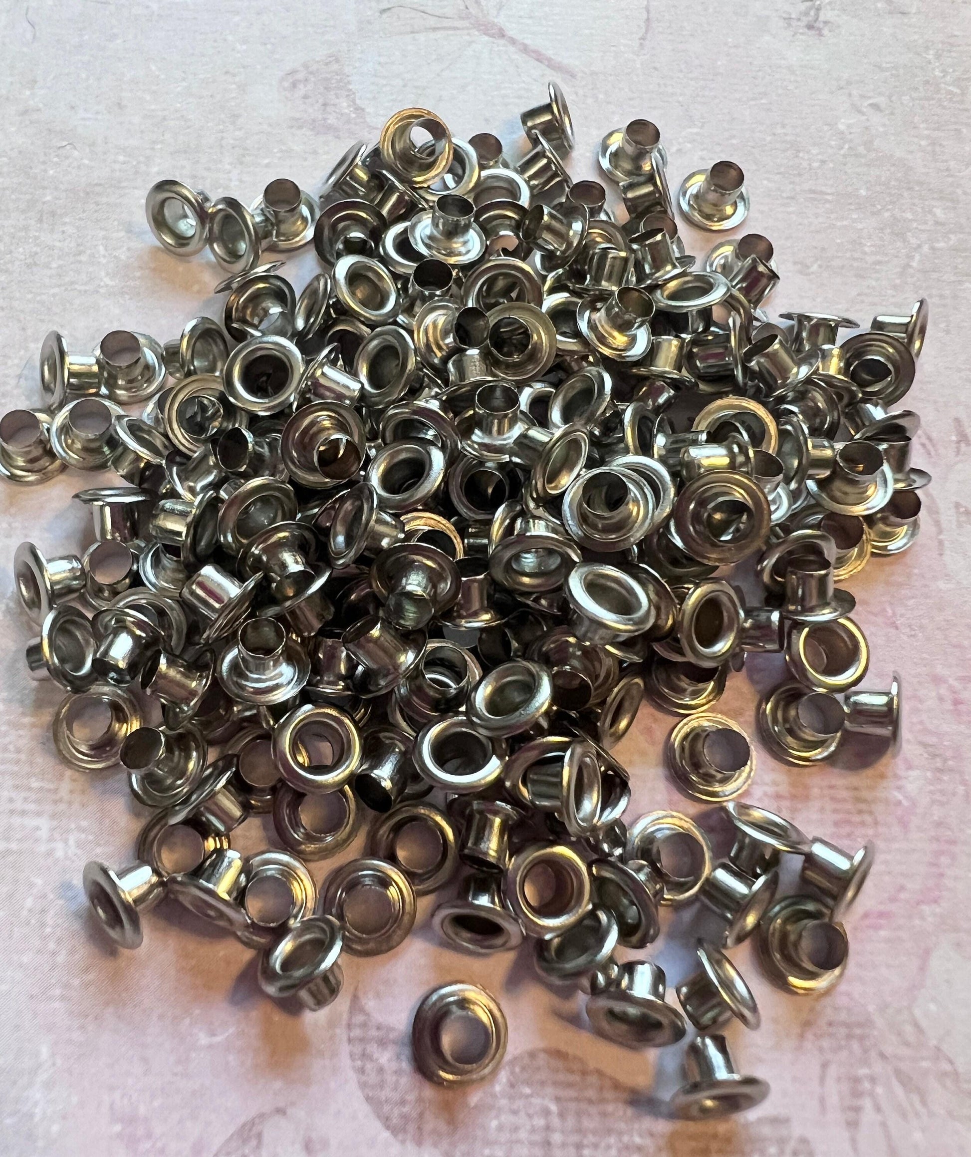 Image of a pile of silver tone 3mm bead caps (etsy image id: 7811905433)