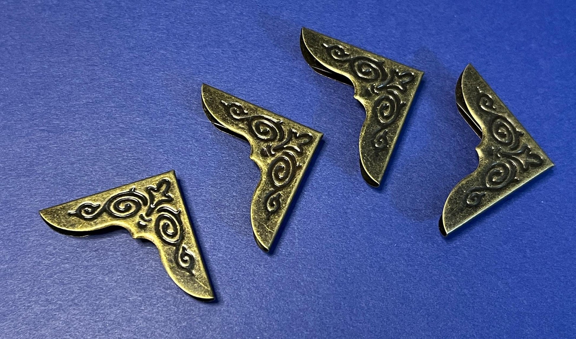 Antique style metal filigree book corners for handmade and treasured books 1 1/8 inch (etsy image id: 7819009843)